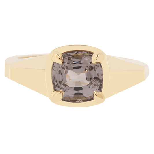 Lauren Wolf - Gold ring with a smoky gemstone on a white background