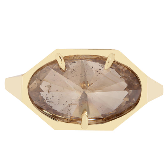 Lauren Wolf - Gold ring with a large, faceted champagne diamond on a white background