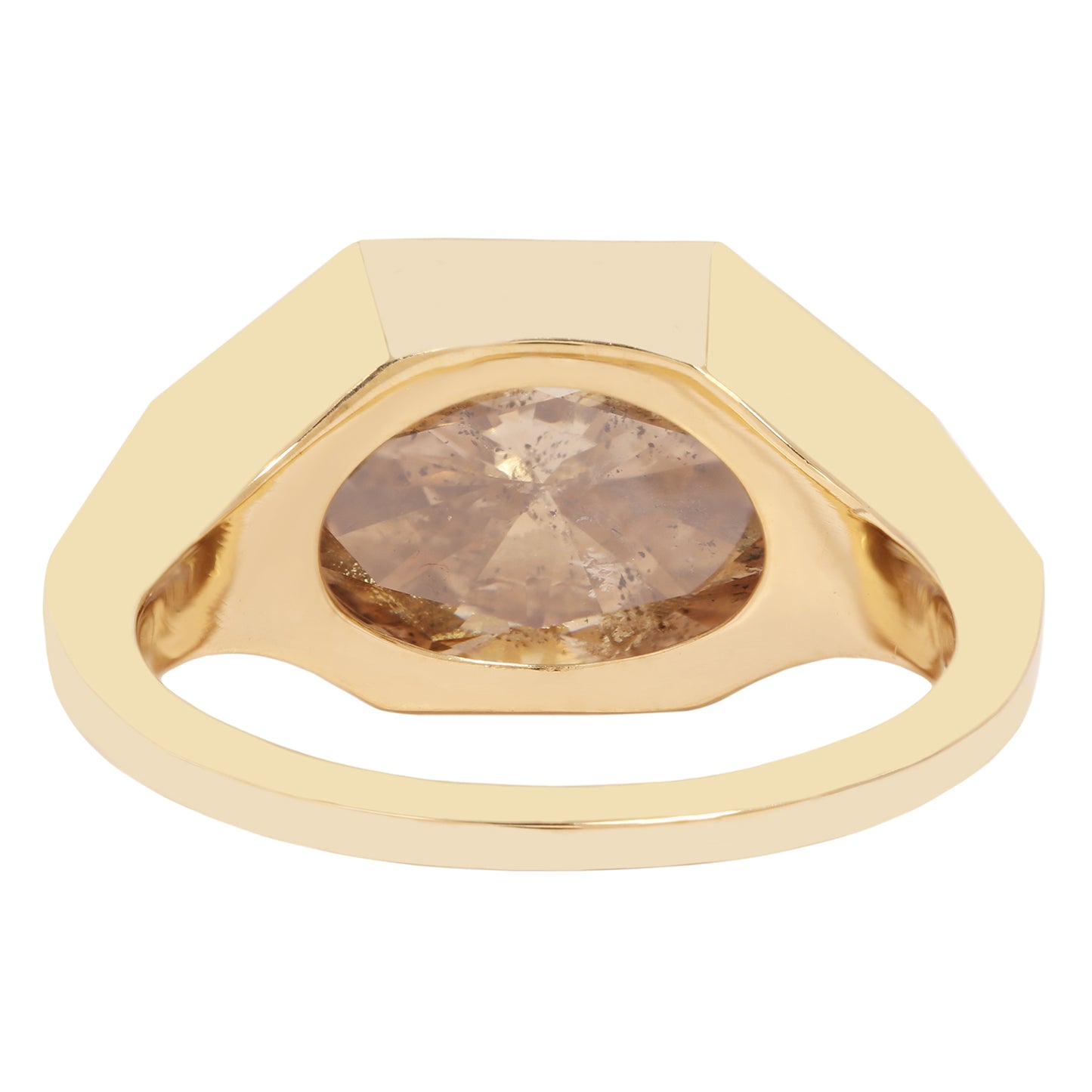 Lauren Wolf - Gold ring with a large, faceted diamond on a white background