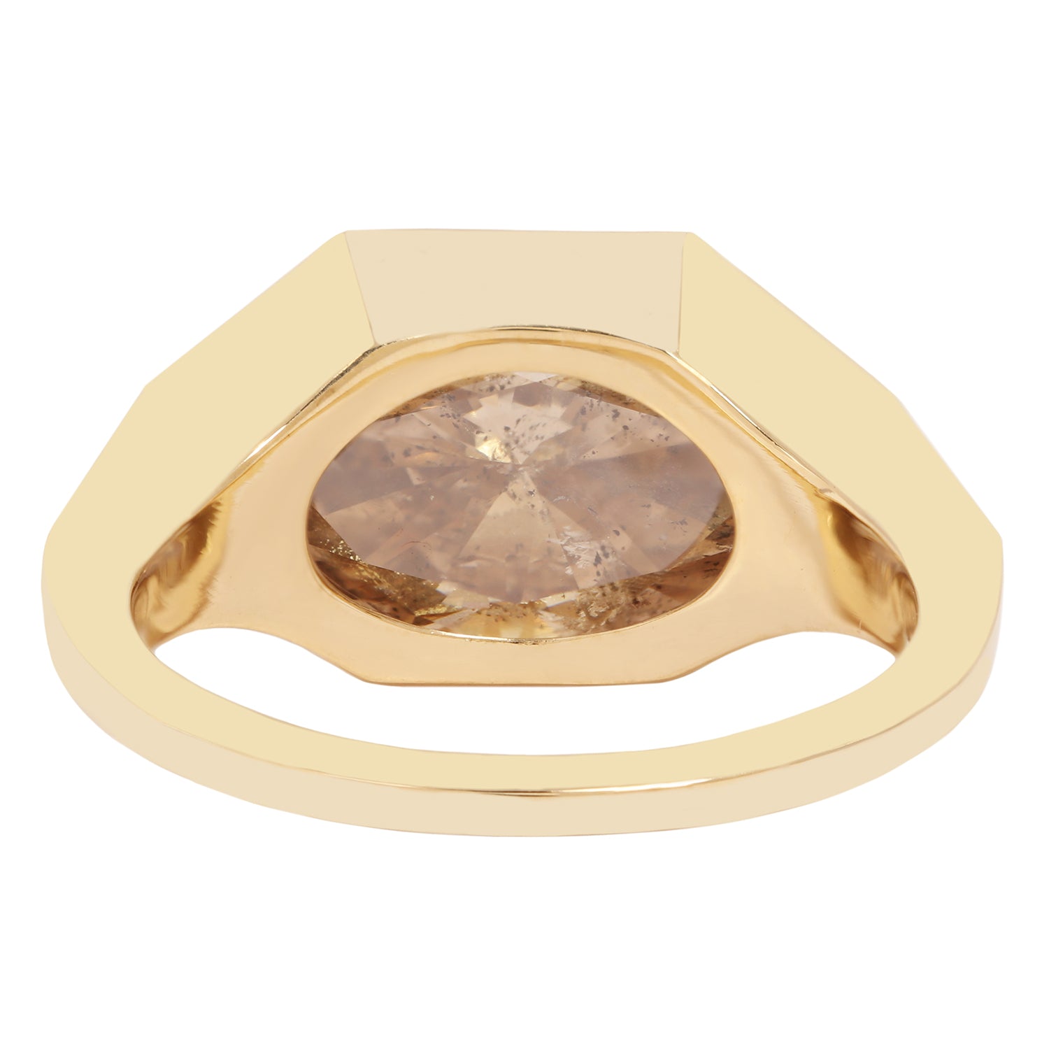 Lauren Wolf - Gold ring with a large, faceted diamond on a white background