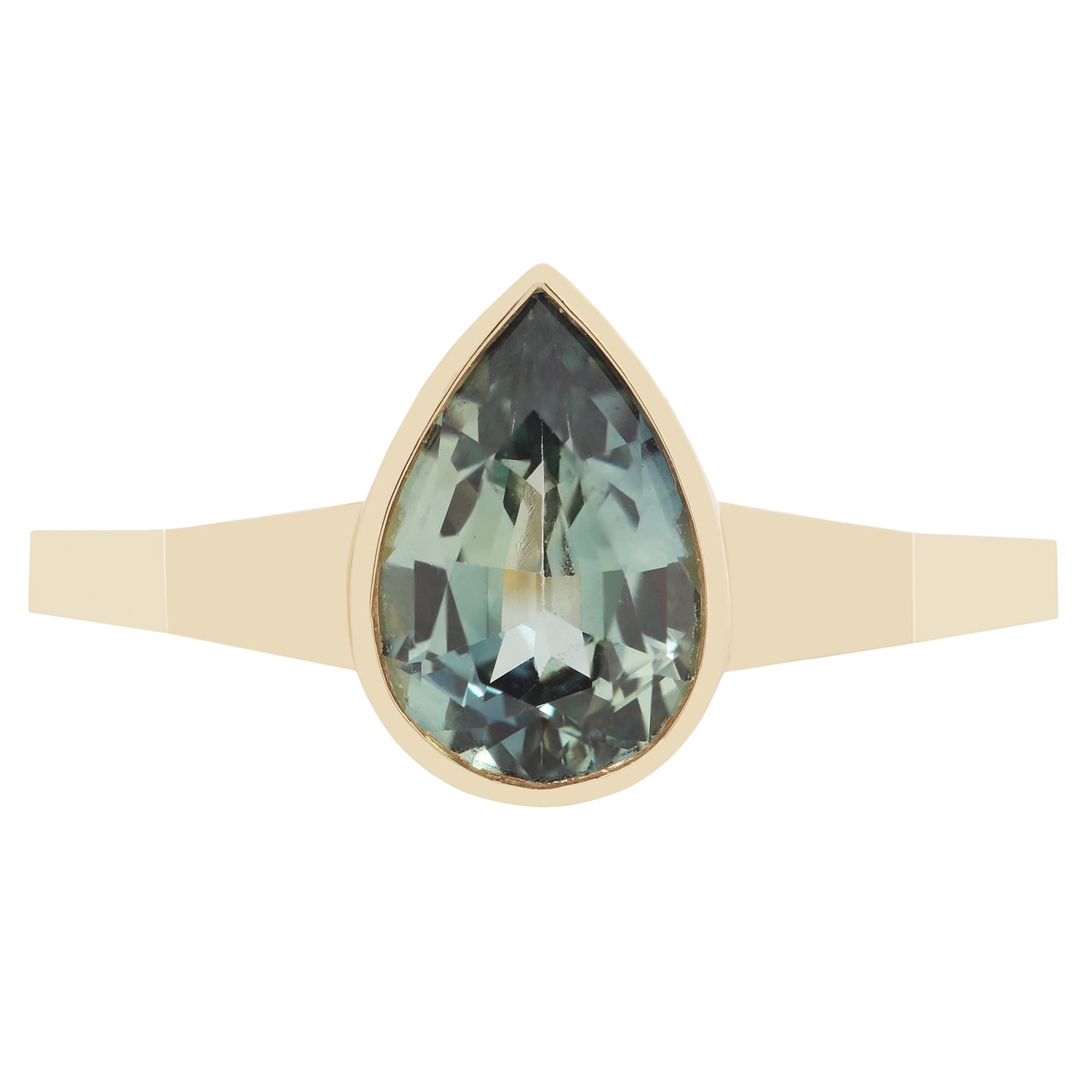 Gold ring with a green teardrop-shaped gemstone on a white background