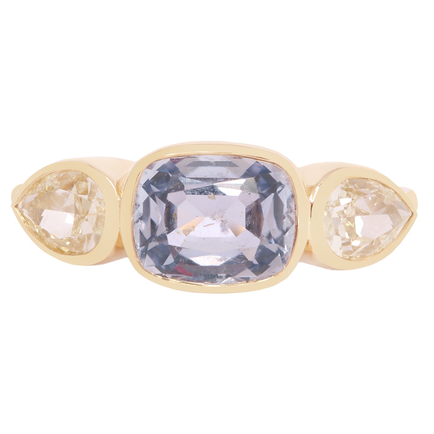 Lauren Wolf - Gold ring with three gemstones on a white background