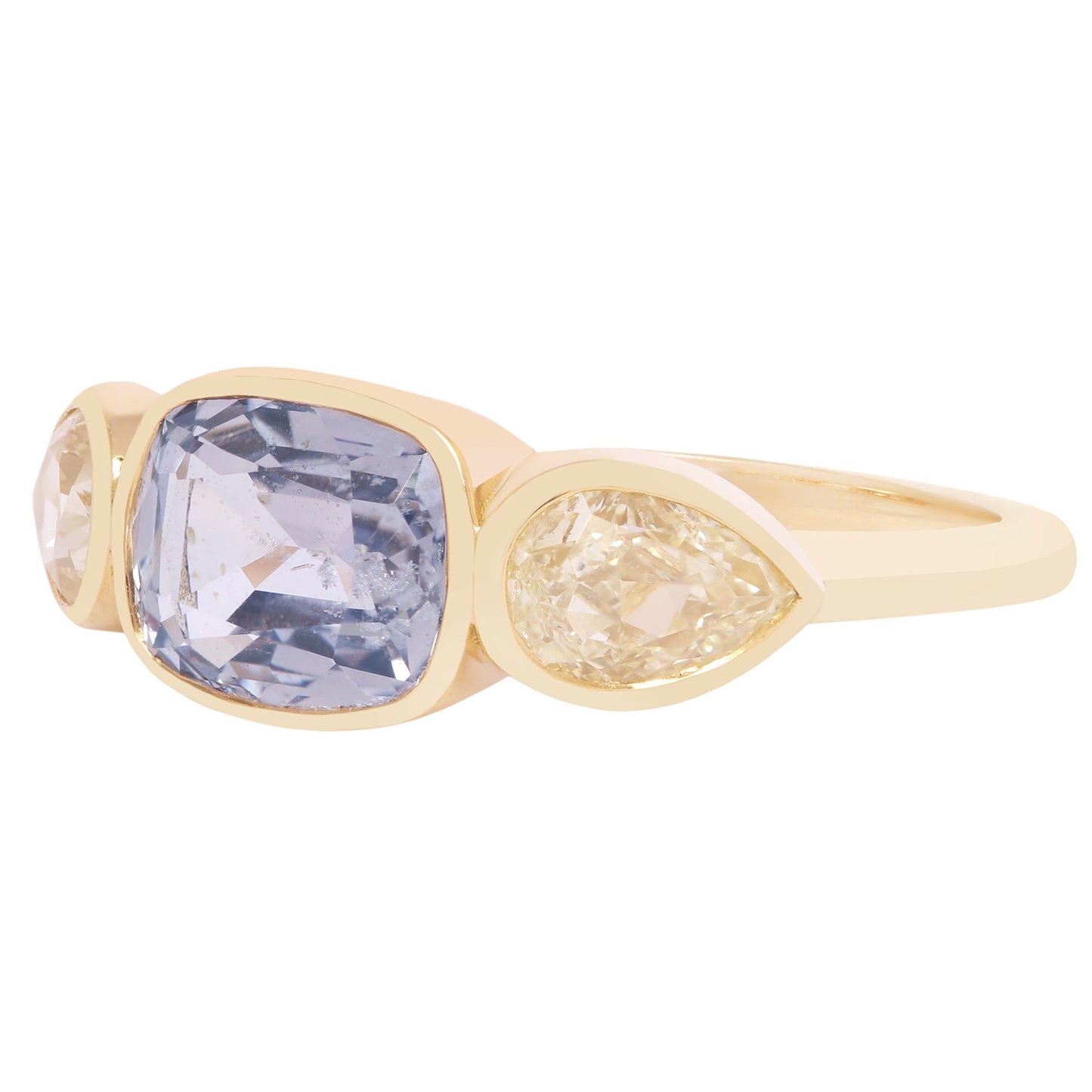 Gold ring with a large purple gemstone and smaller yellow gemstone on a white background