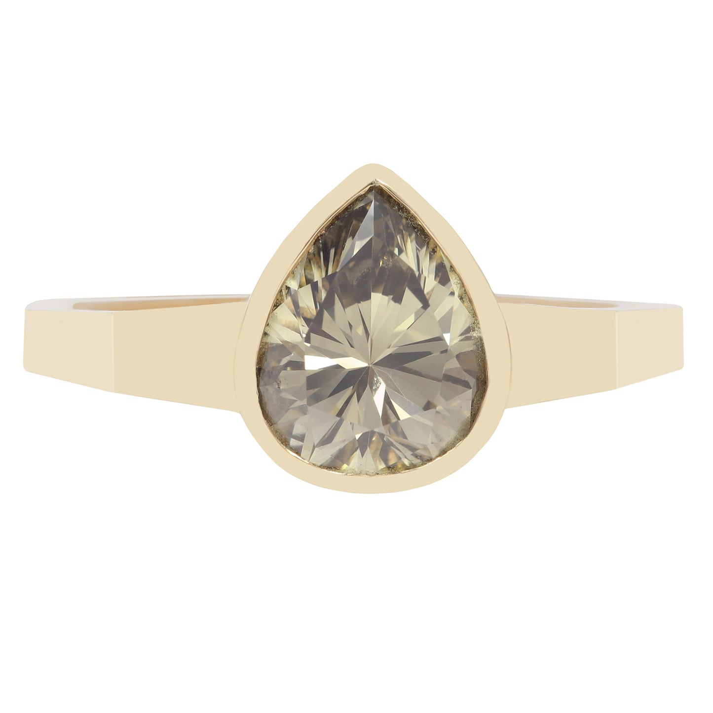 Gold ring with a large teardrop-shaped green diamond on a white background