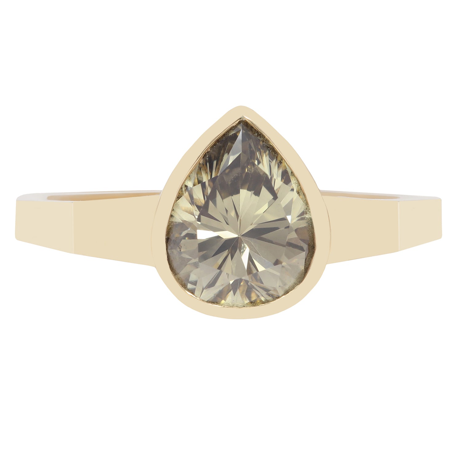 Gold ring with a large teardrop-shaped green diamond on a white background