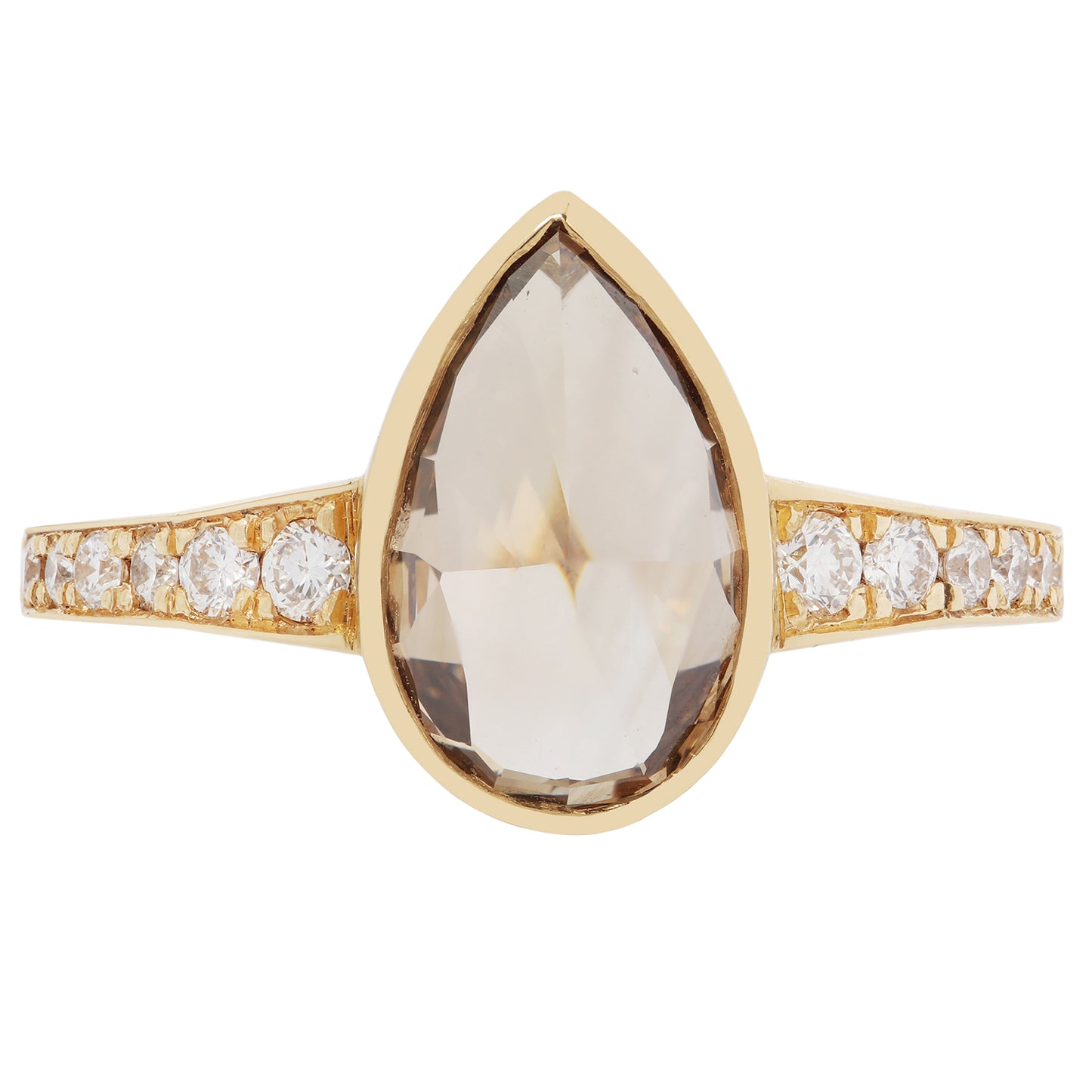 Gold ring with a large teardrop-shaped gemstone and smaller diamonds on a white background