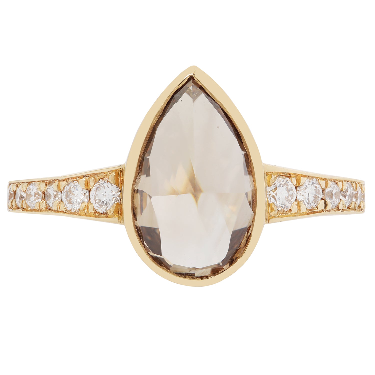 Gold ring with a large teardrop-shaped gemstone and smaller diamonds on a white background