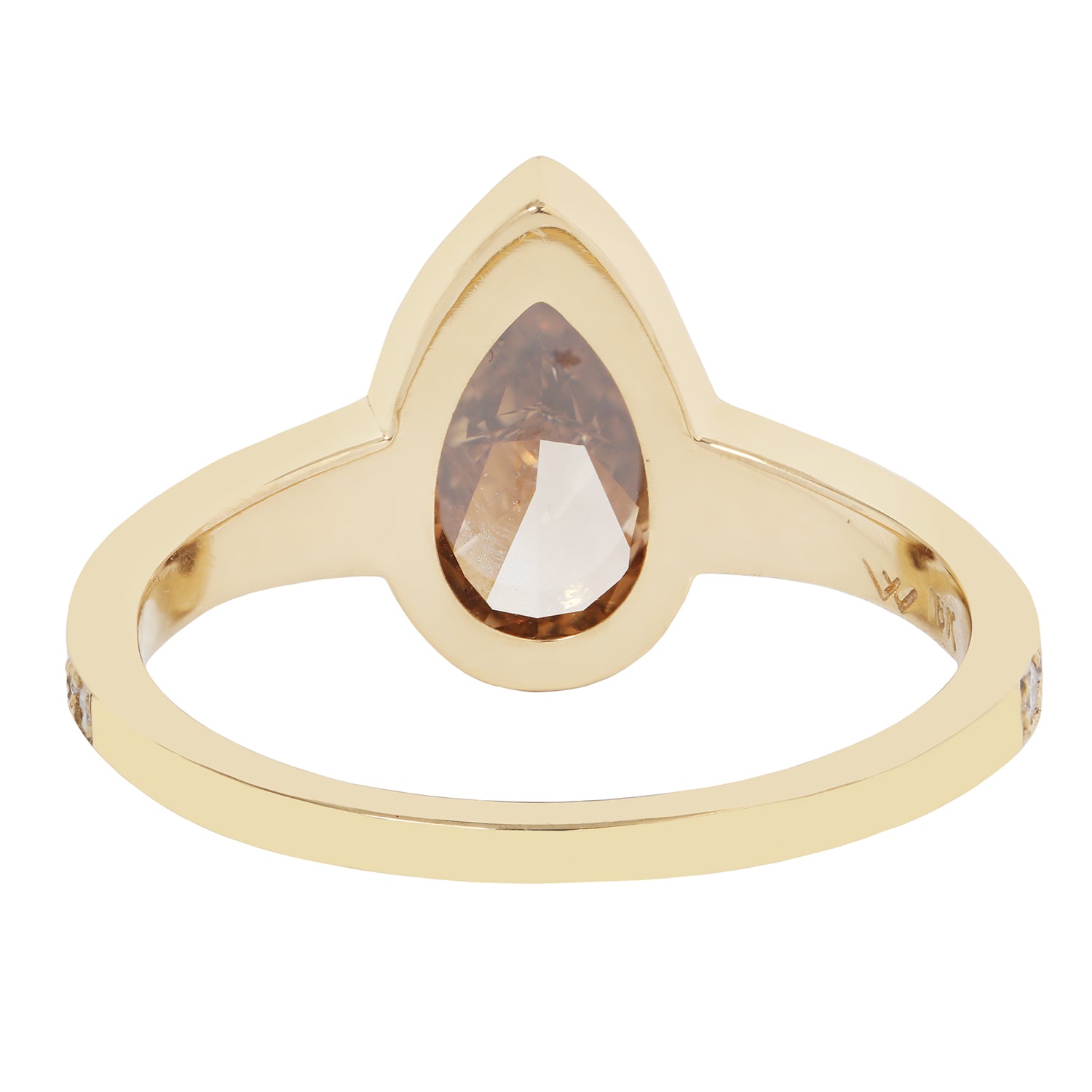 Gold ring with a pear-shaped gemstone on a white background