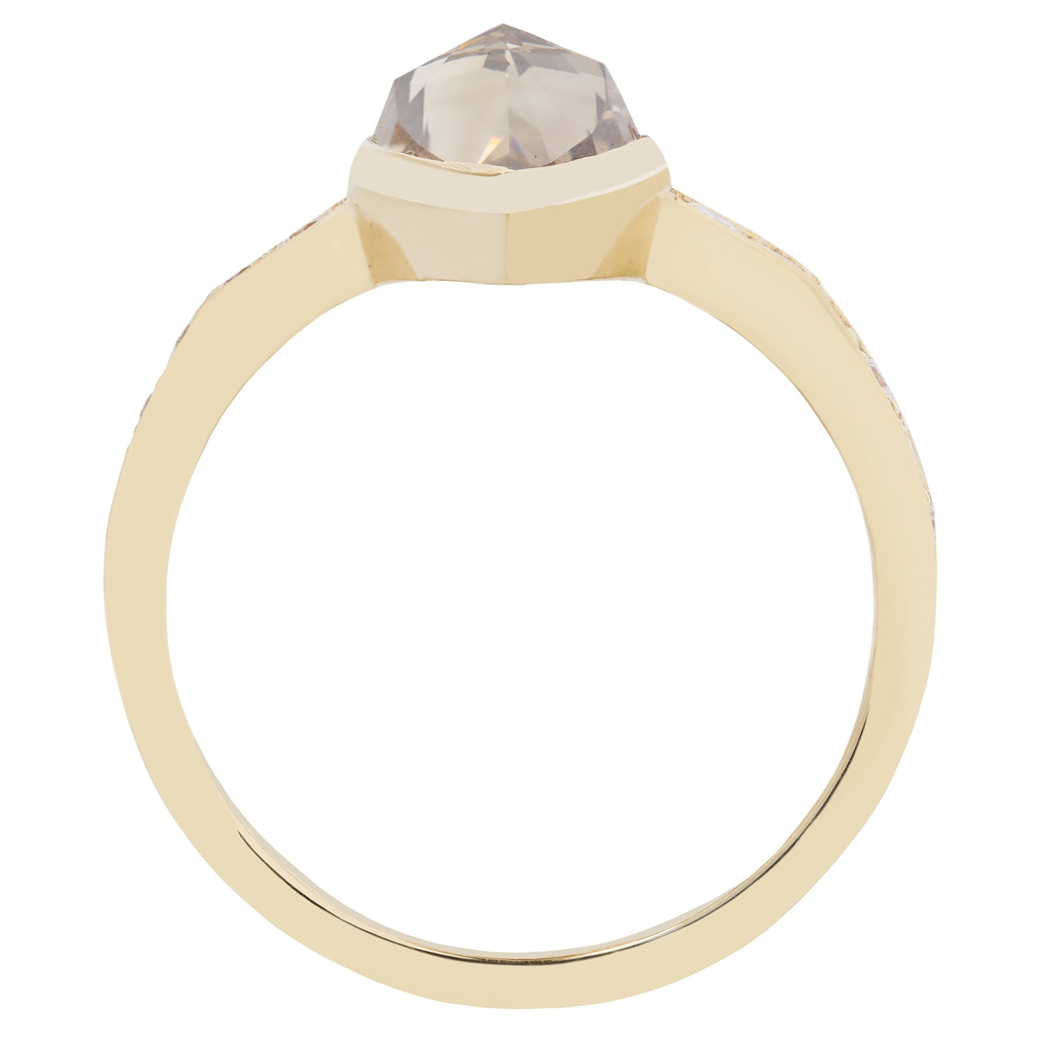 Gold ring with a clear gemstone on a white background