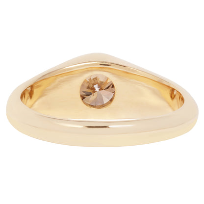 Lauren Wolf - Gold ring with a central gemstone on a white background