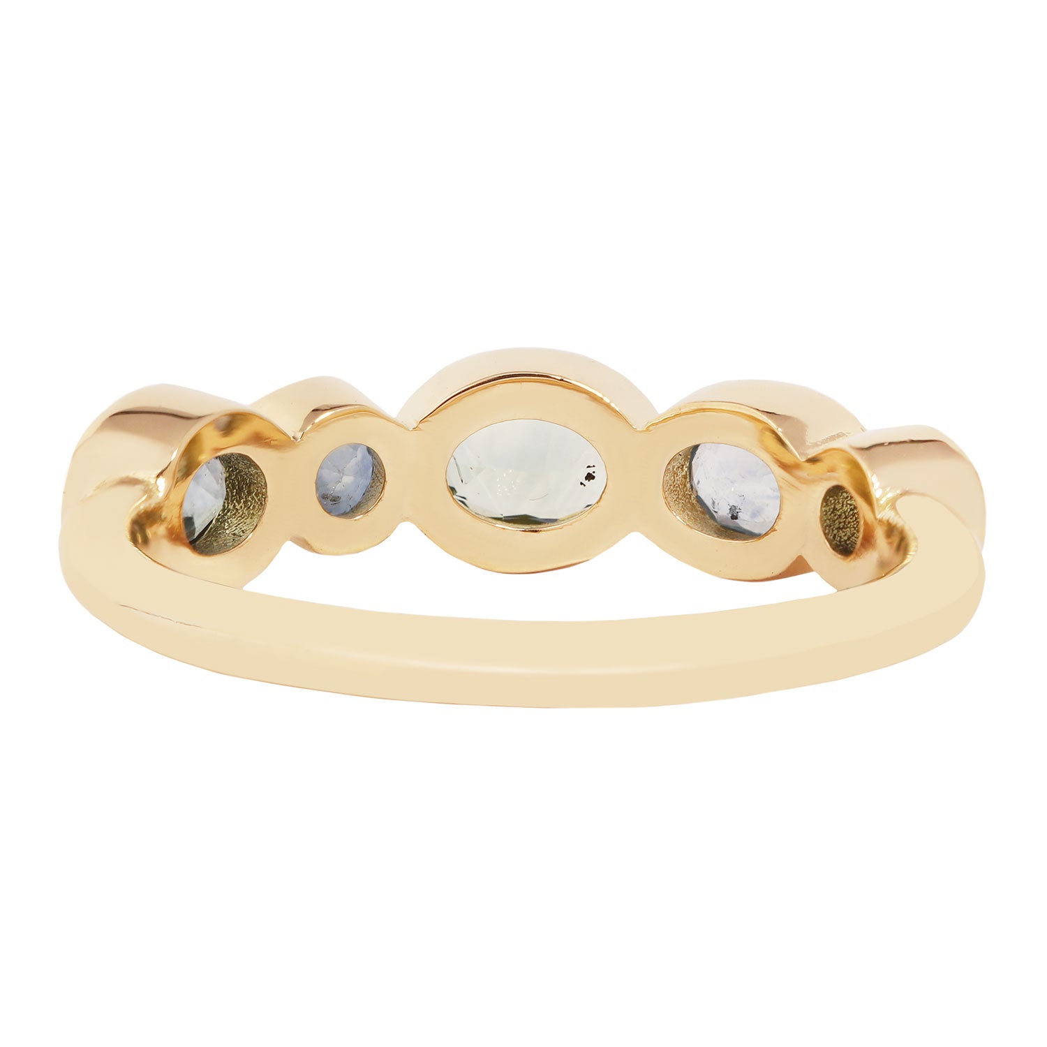 Lauren Wolf - Gold ring with embedded stones on a white background