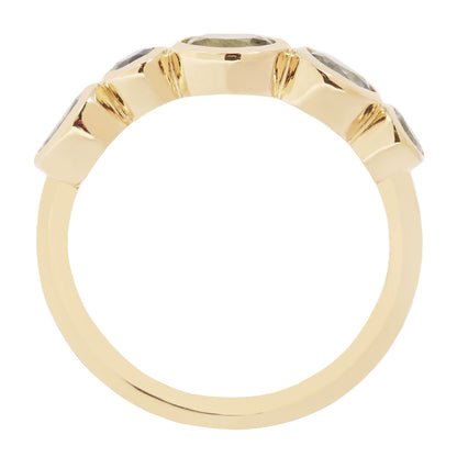 Lauren Wolf - Gold ring with gemstones on a white background