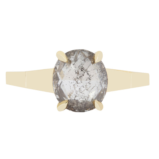 Ring with a large oval diamond and gold band on a white background