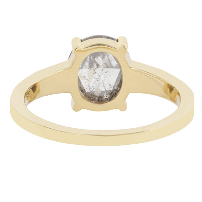 Gold ring with a diamond on a white background