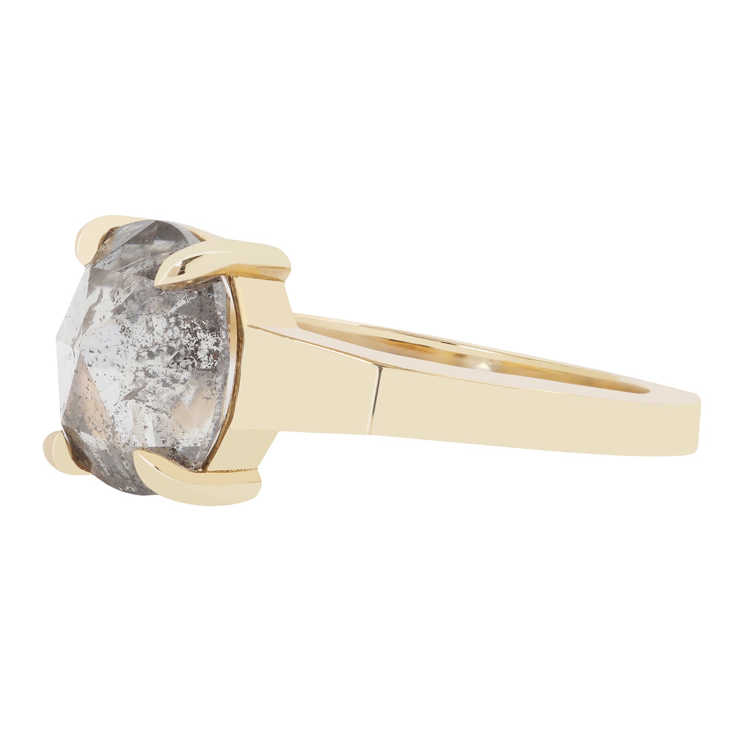 Gold ring with a large gray diamond on a white background