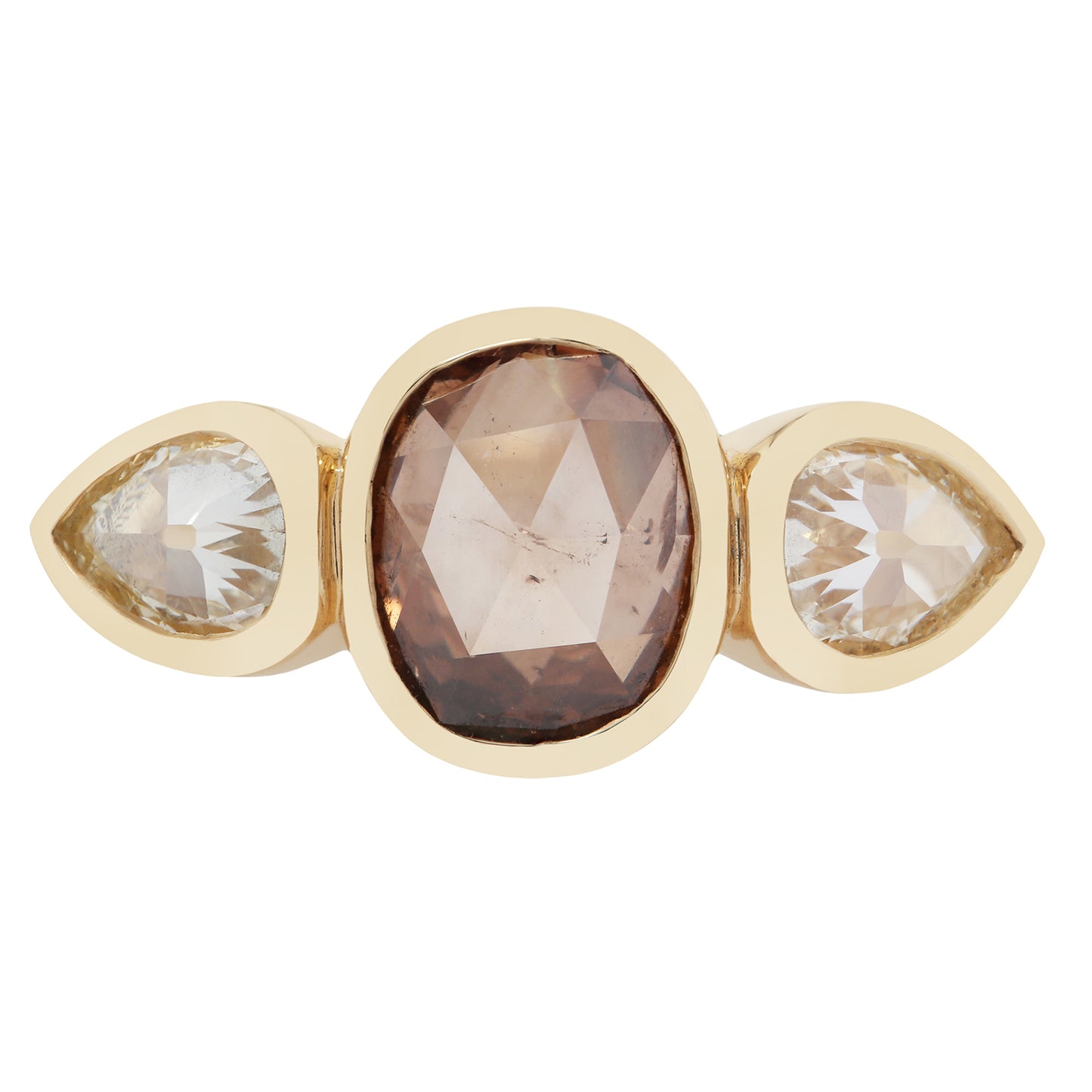 Gold ring with three gemstones on a white background