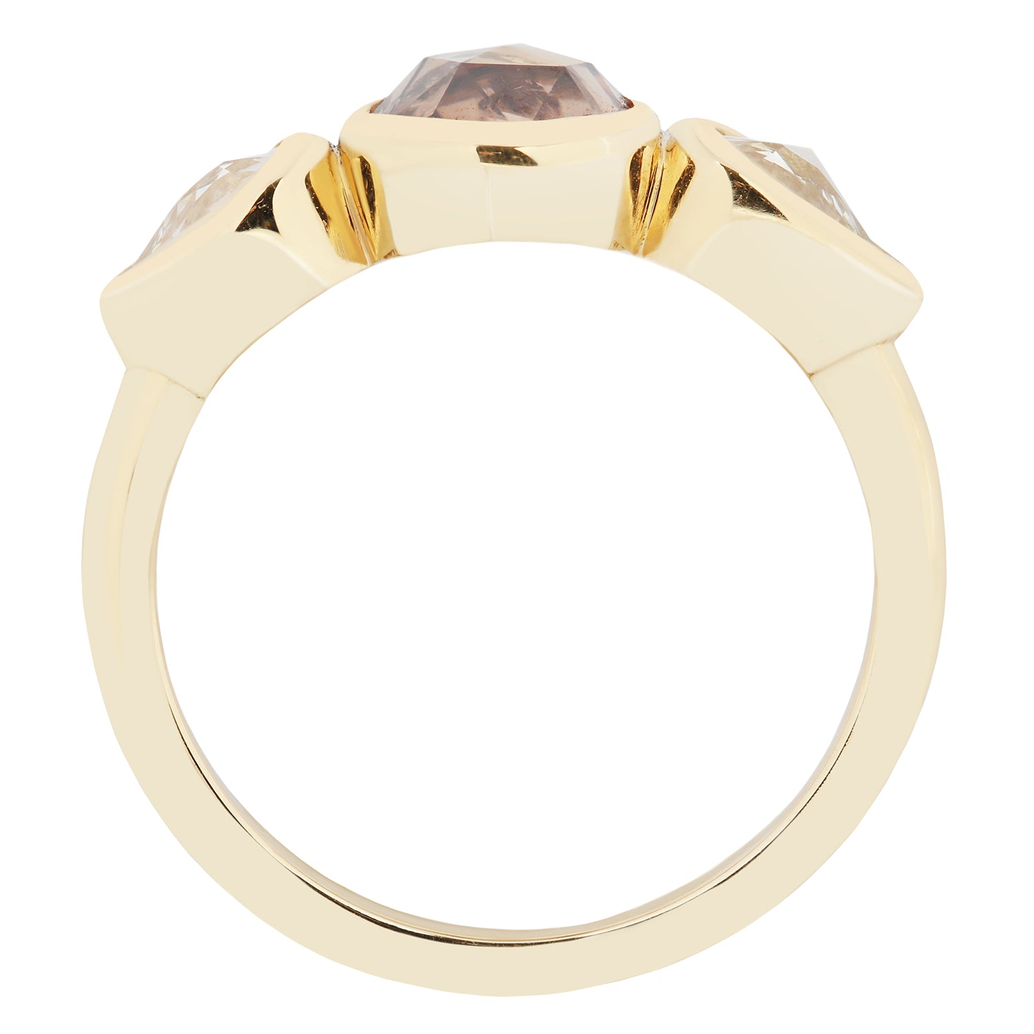 Gold ring with a three gemstones on a white background