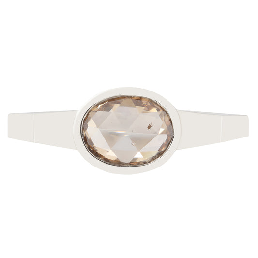 Ring with a large faceted gemstone on a white background
