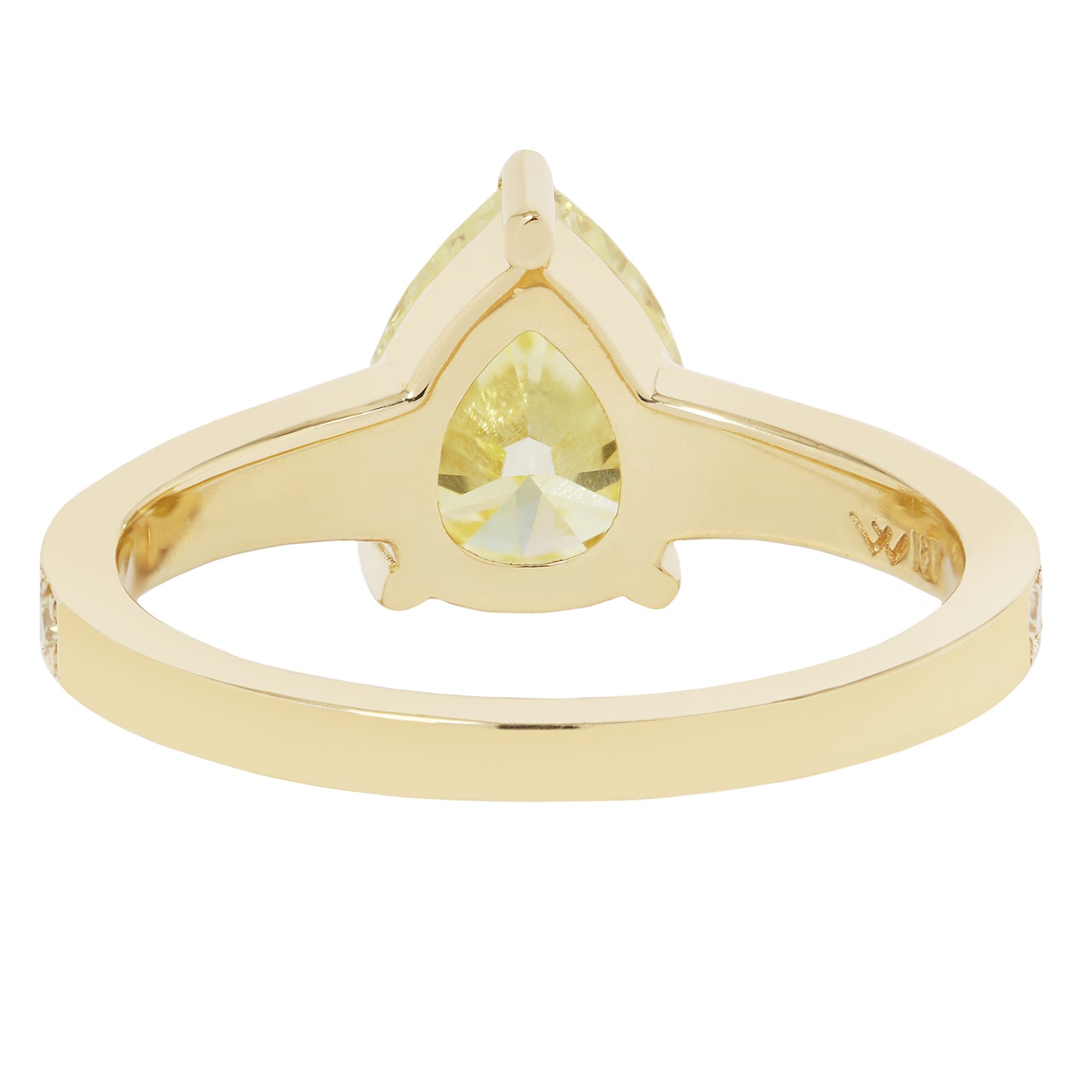 Gold ring with a yellow gemstone on a white background
