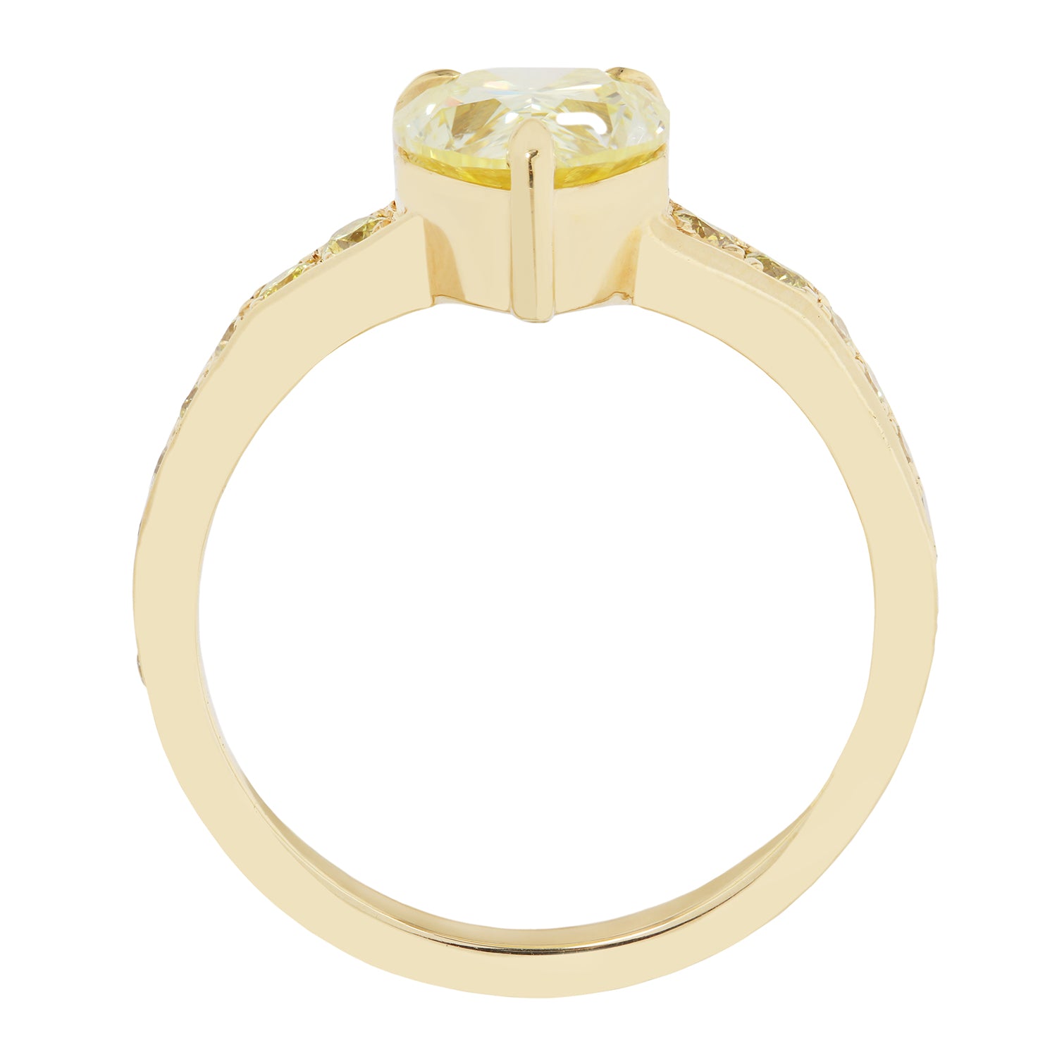 Gold ring with a yellow gemstone on a white background