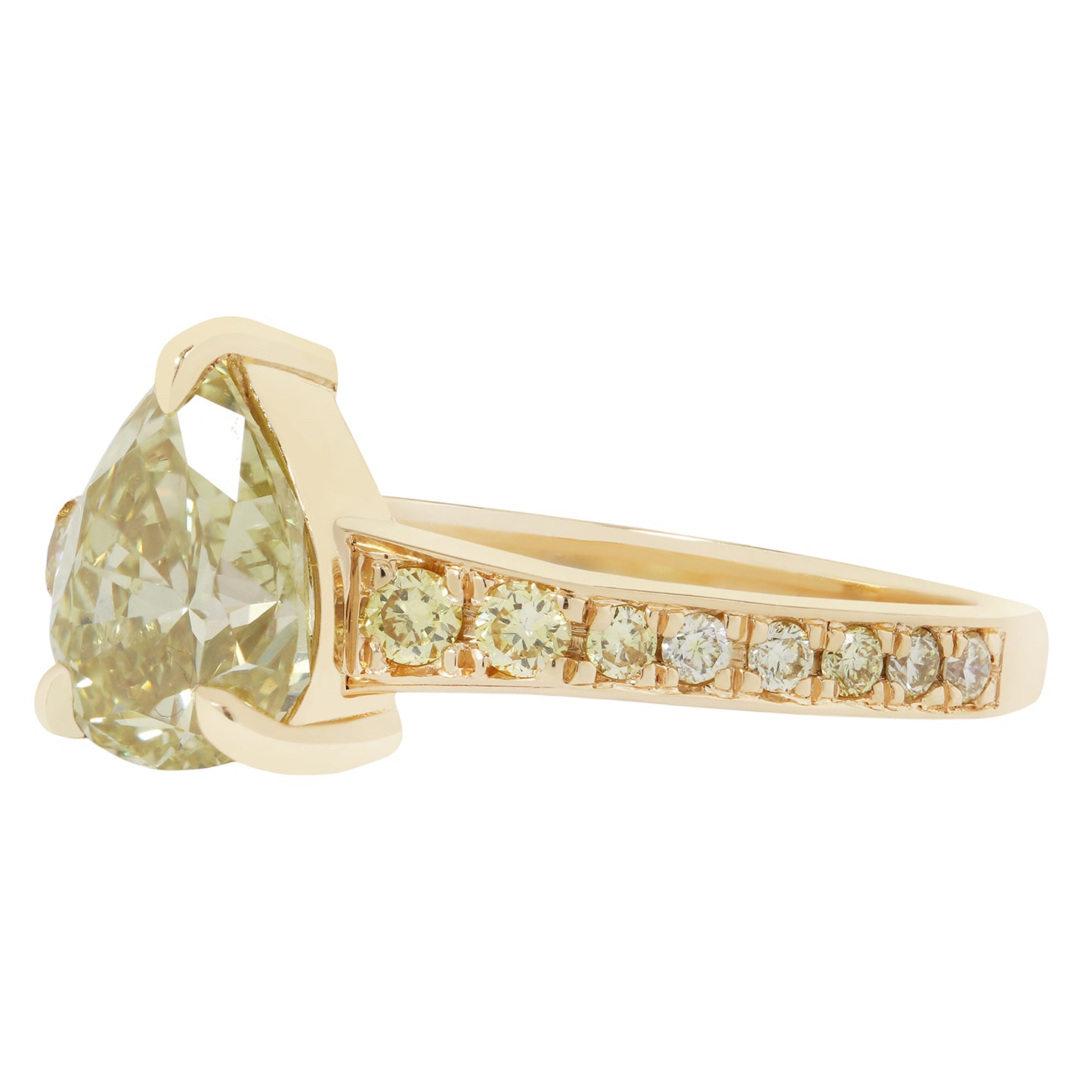 Gold ring with a large green gemstone and smaller diamonds on a white background