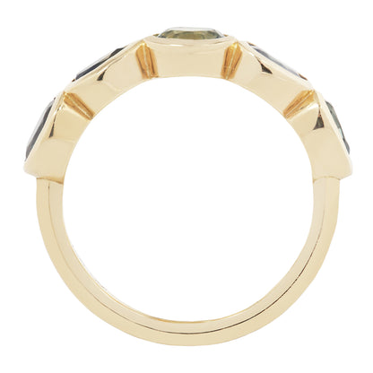 Gold ring with gemstones on a white background