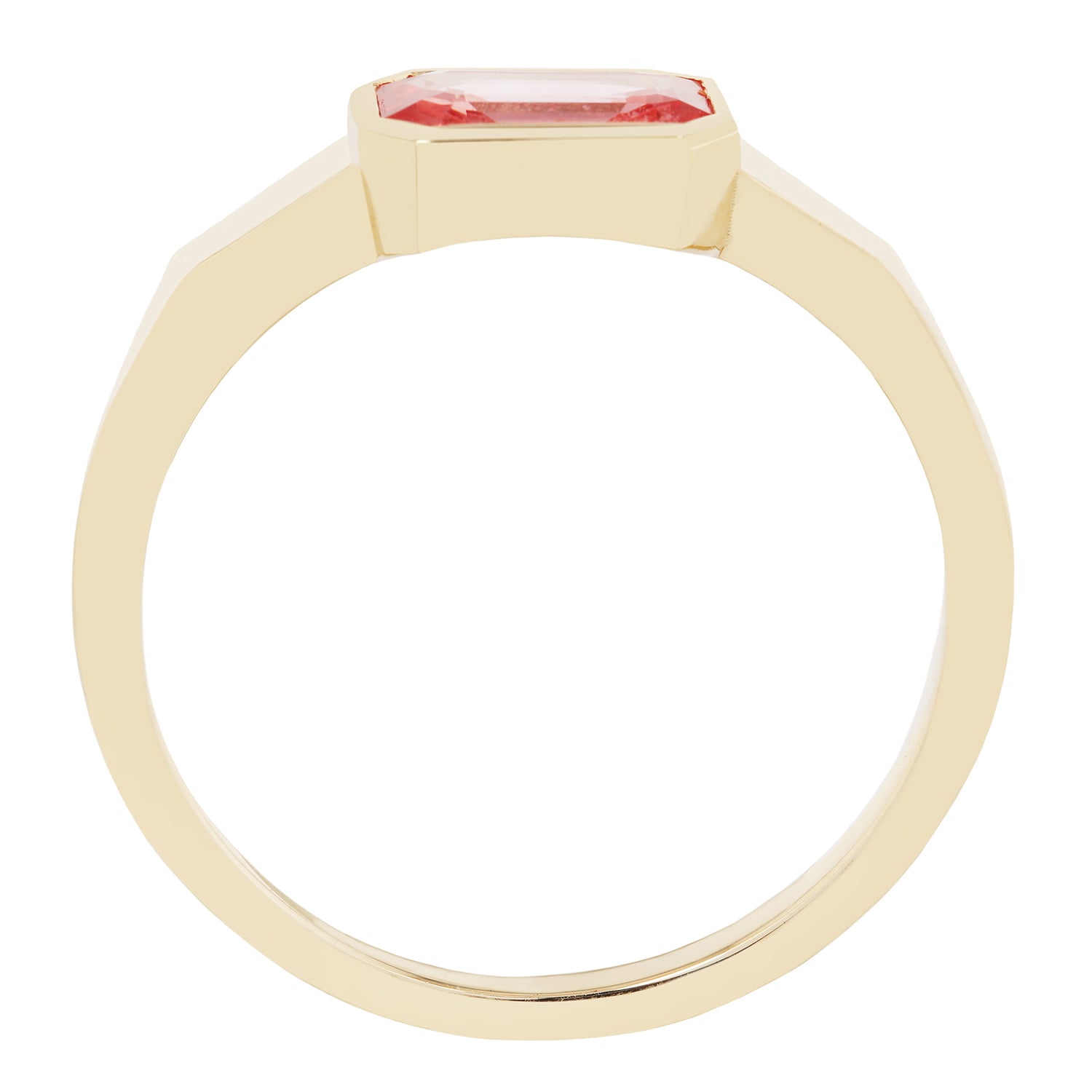 Gold ring with a pink gemstone on a white background