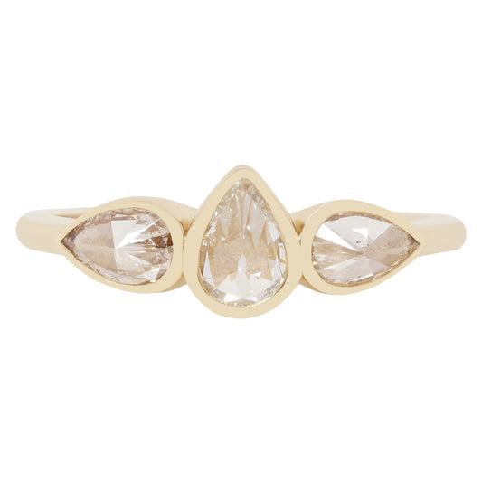 A gold ring featuring three marquise-cut clear gemstones set in a row, with a pear-shaped center stone and two smaller marquise stones on either side, shown on a plain white background.