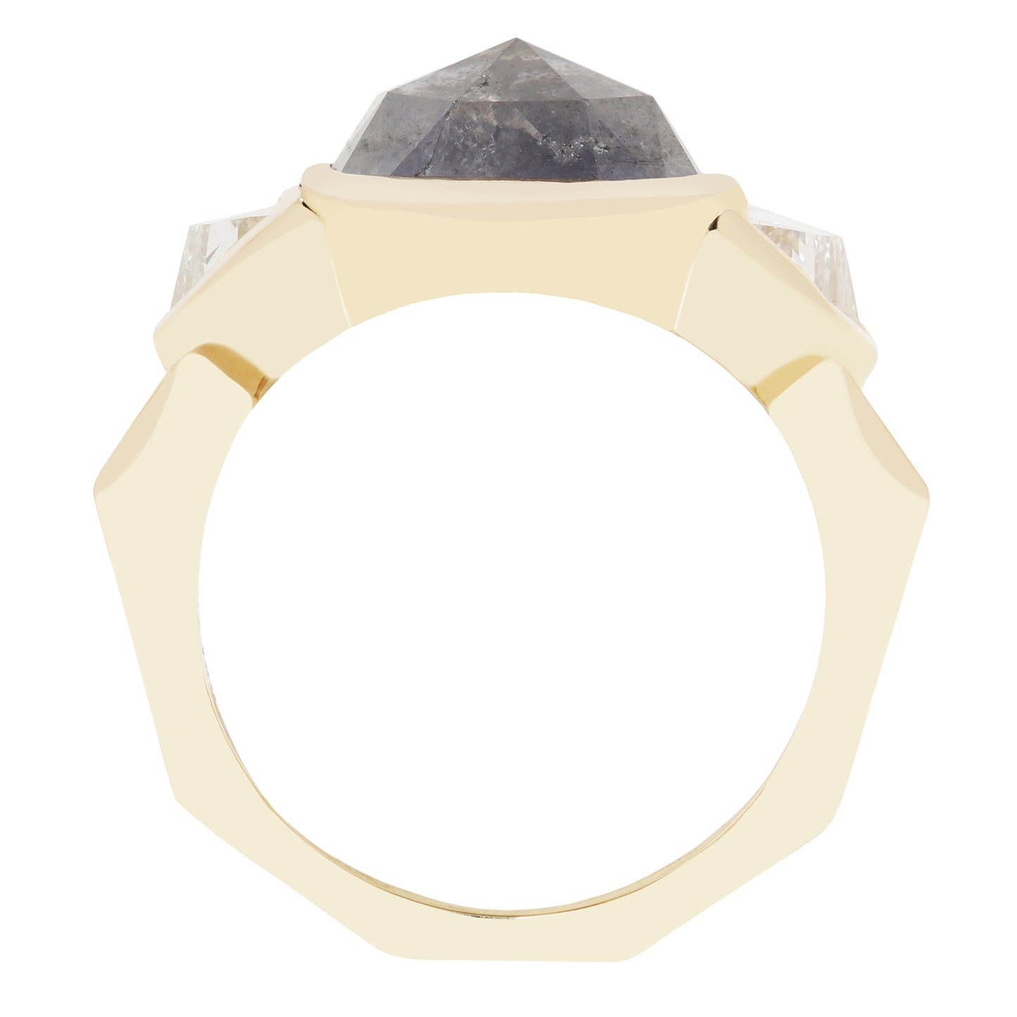 A geometric octagonal ring featuring a faceted dark gray diamond stone in a gold setting, flanked by two clear round-cut stones on a plain white background.