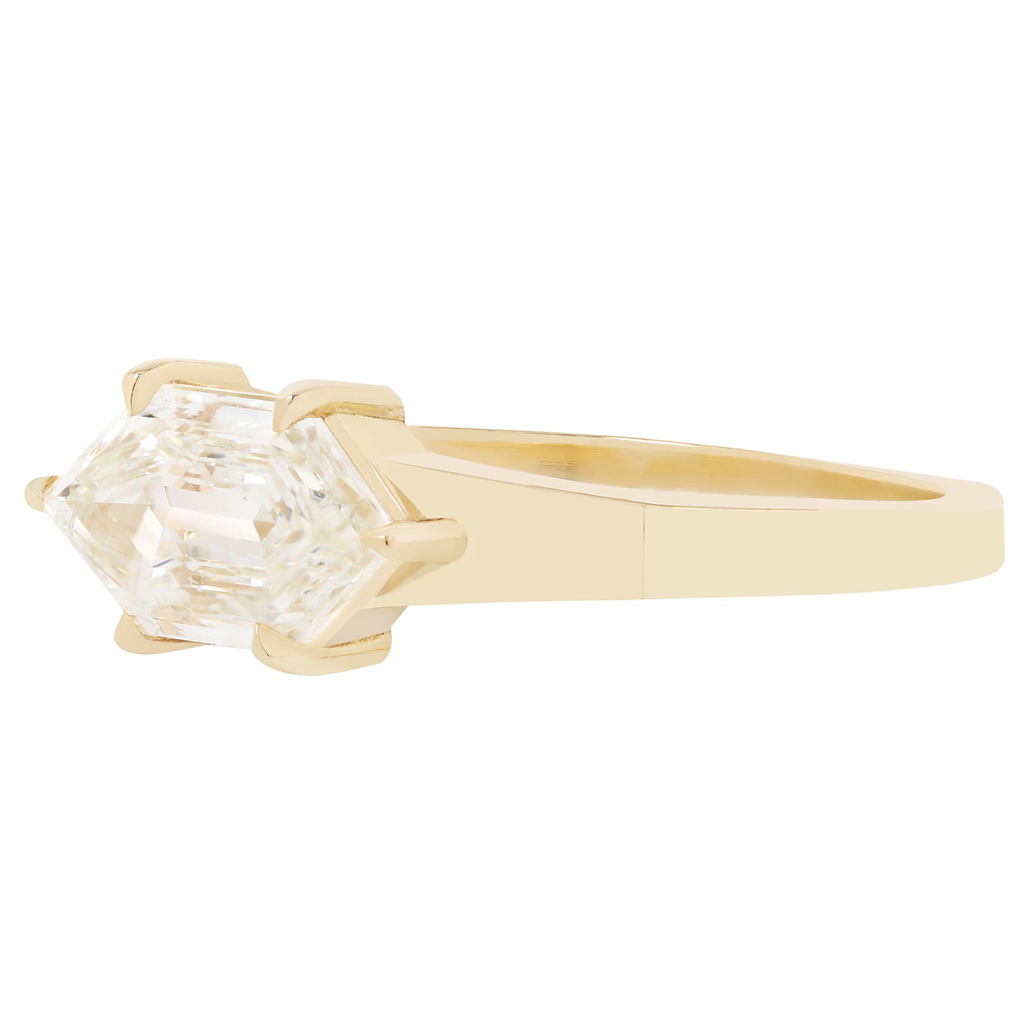 Gold ring with a diamond on a white background