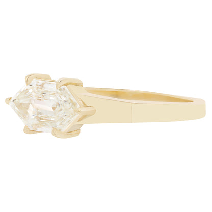 Gold ring with a diamond on a white background