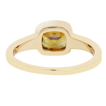 Gold ring with a brown diamond on a white background