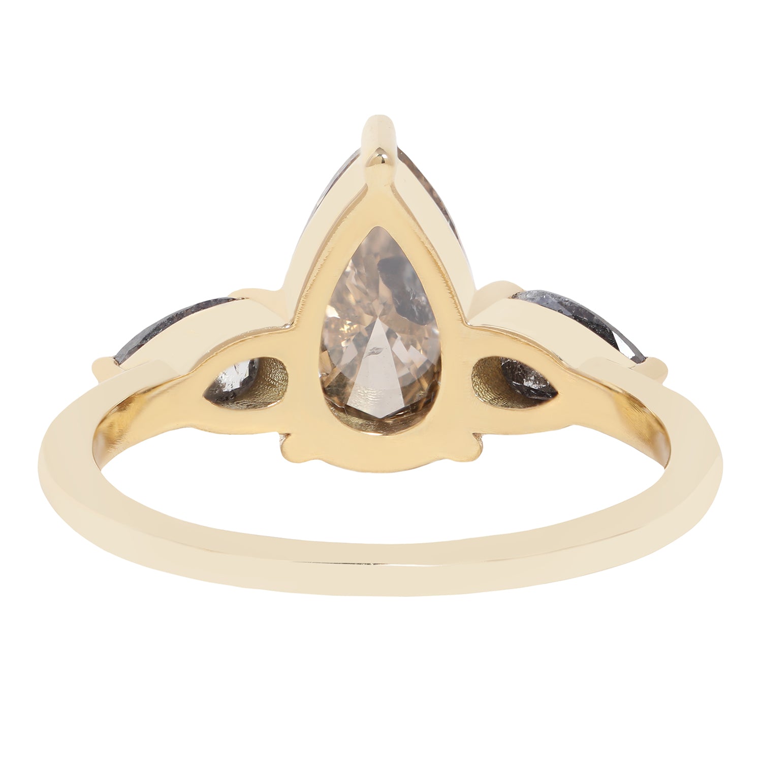 A gold ring featuring a large pear-cut clear diamond with inclusions, accented by two smaller marquise-cut gray diamonds on either side, shown on a plain white background.