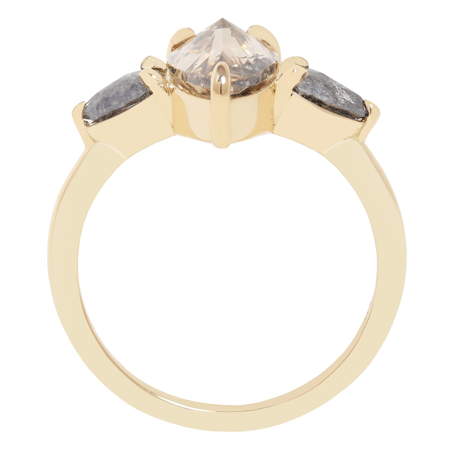 A gold ring featuring a large pear-cut clear diamond with inclusions, accented by two smaller marquise-cut gray diamonds on either side, shown on a plain white background.