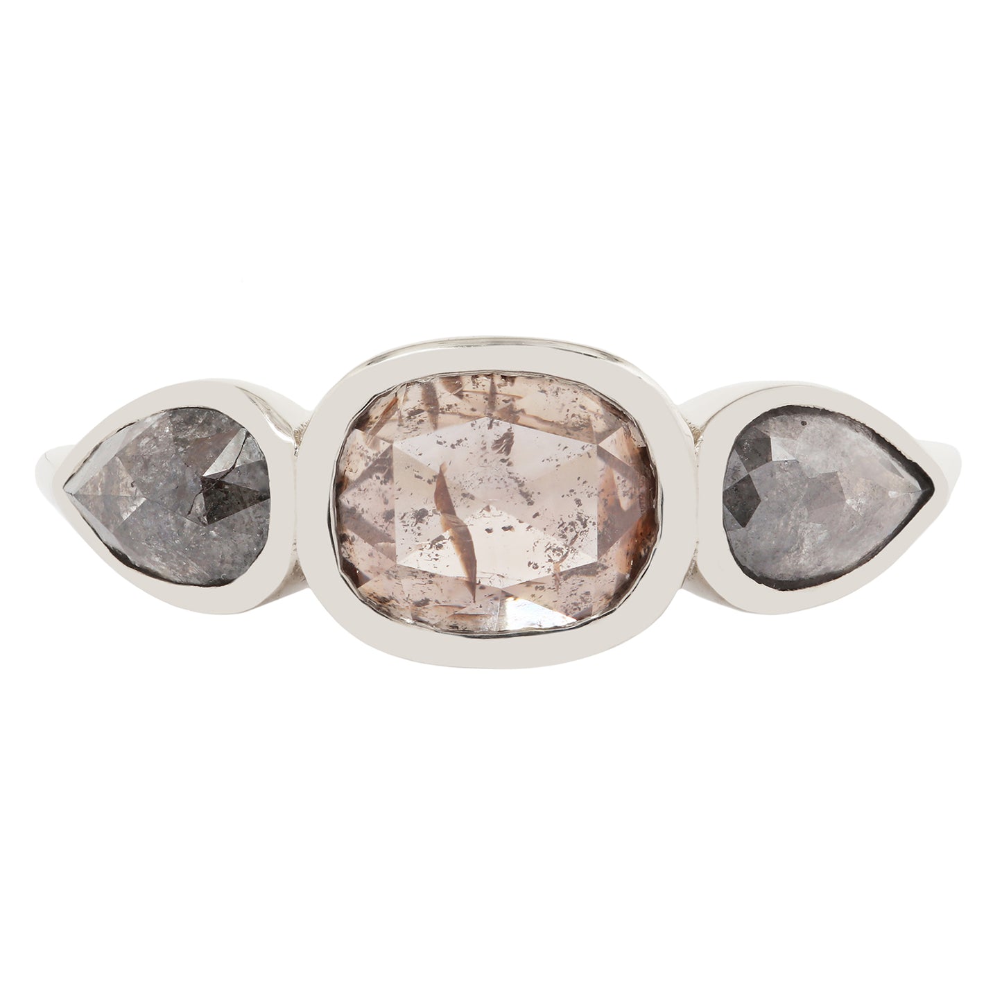 White gold ring with three pear-shaped gemstones on a white background