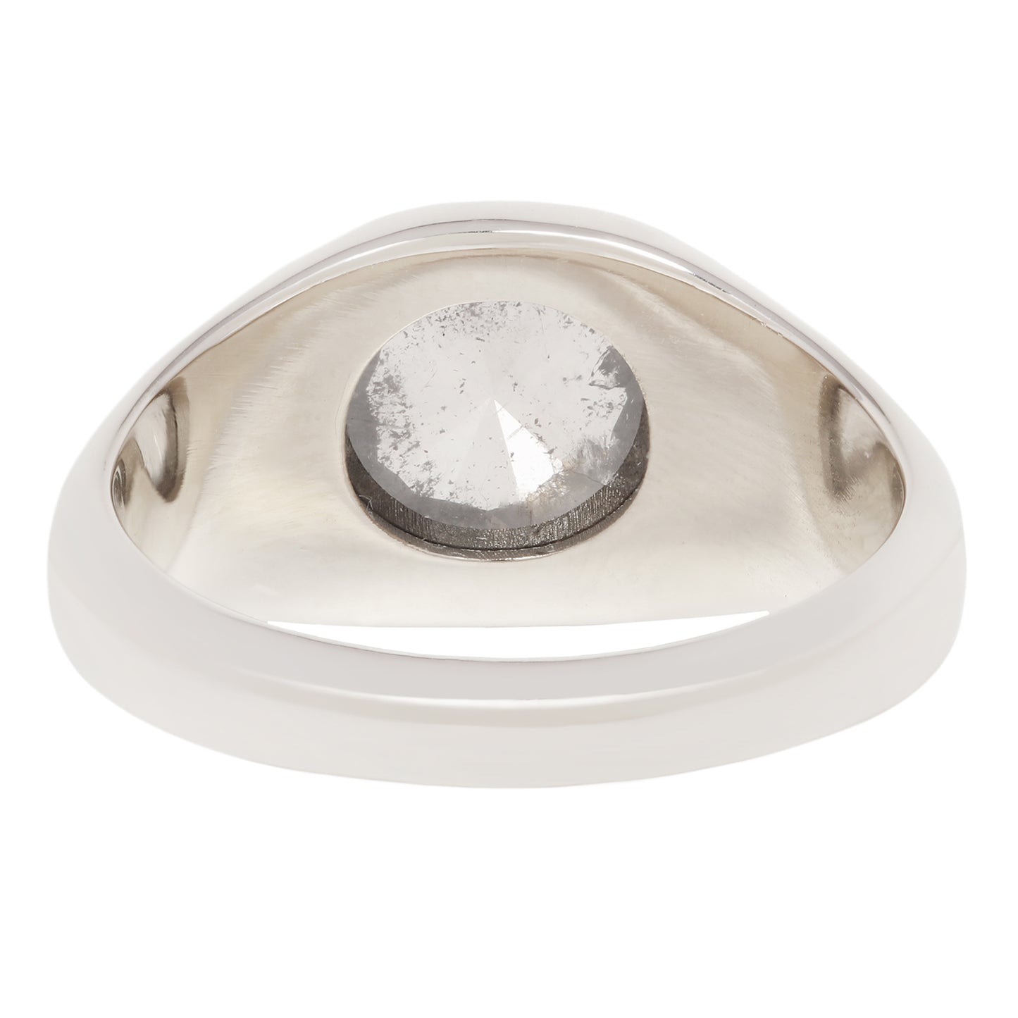 A silver-toned ring with a large, bezel-set round clear gemstone, shown against a plain white background.