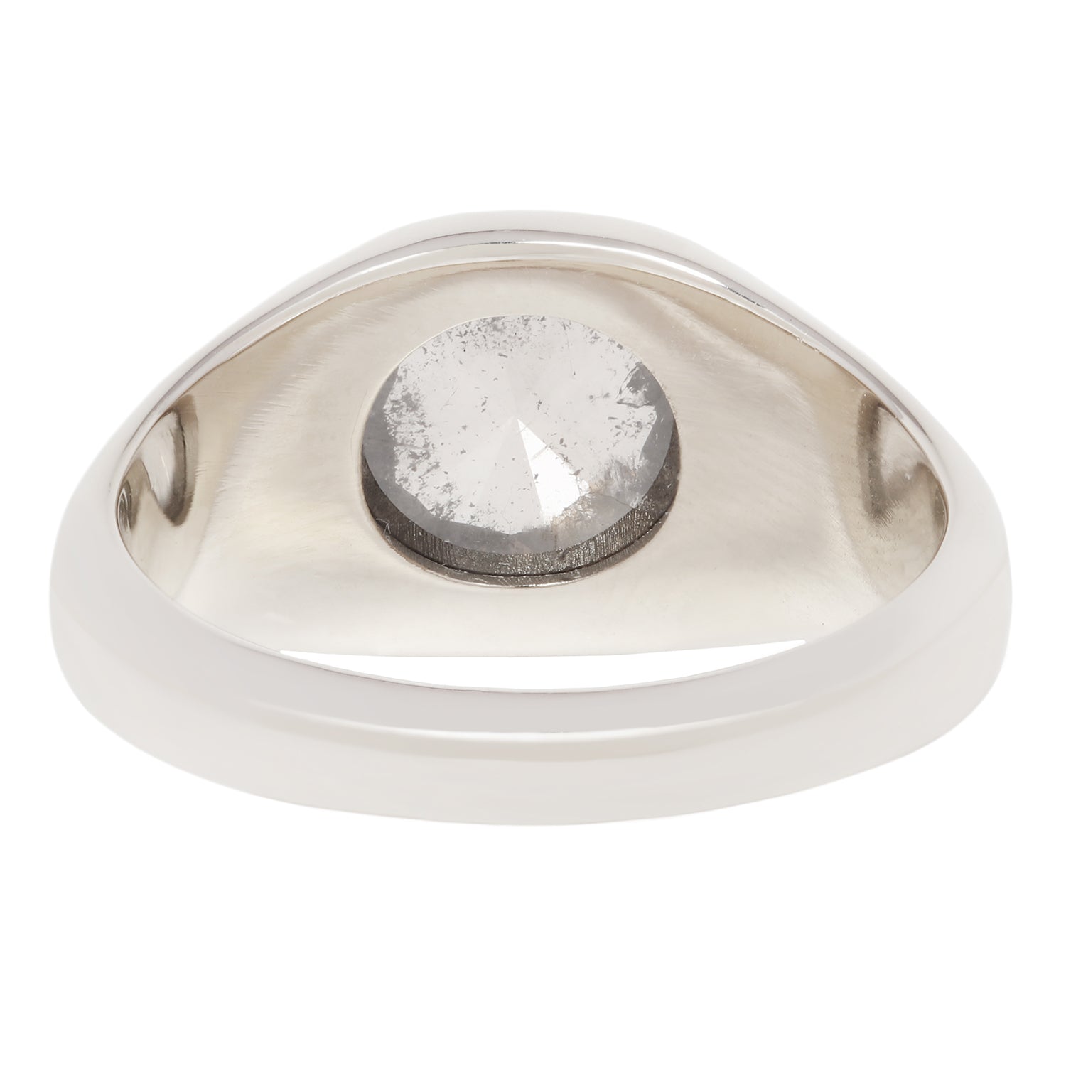 A silver-toned ring with a large, bezel-set round clear gemstone, shown against a plain white background.