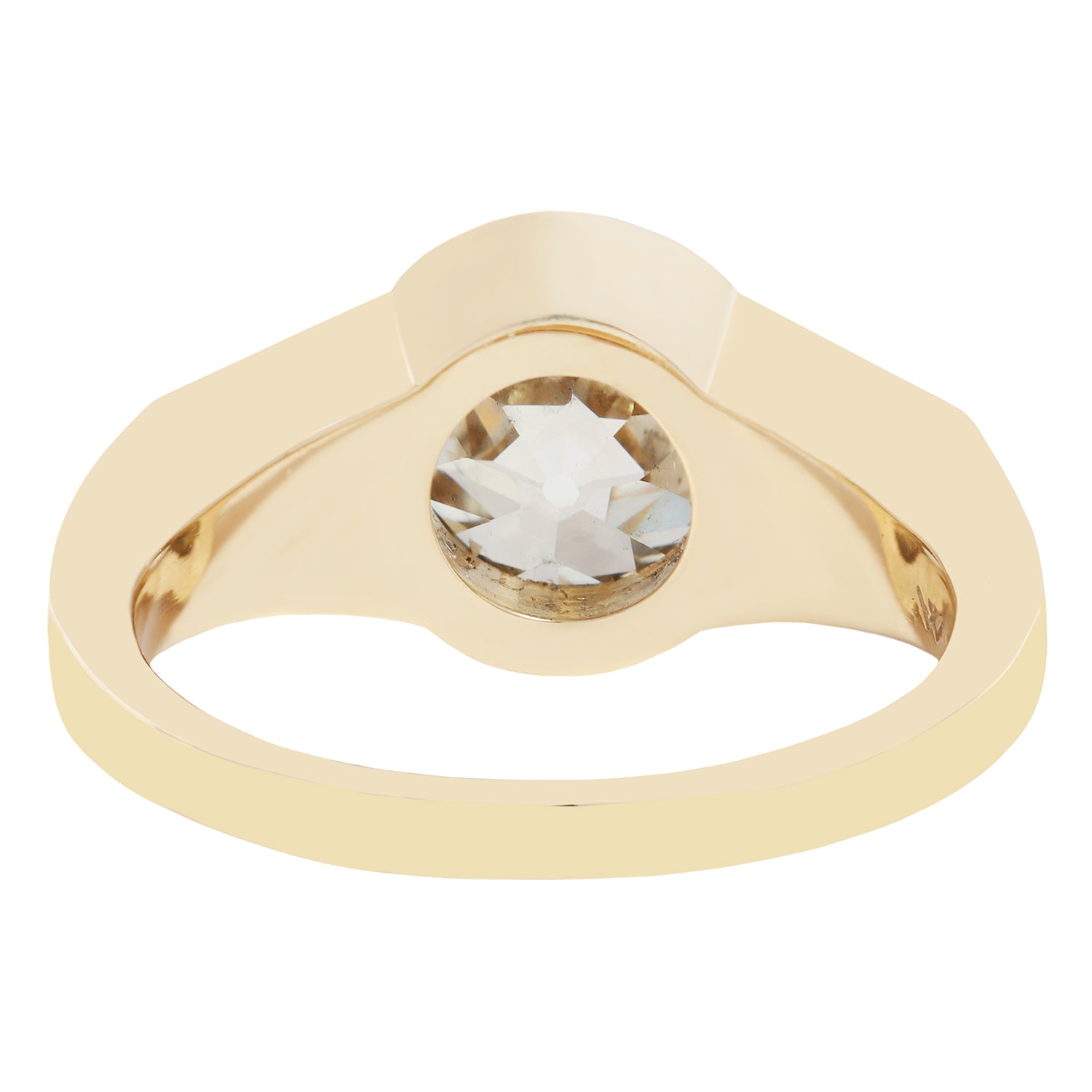 Gold ring with a large diamond on a white background