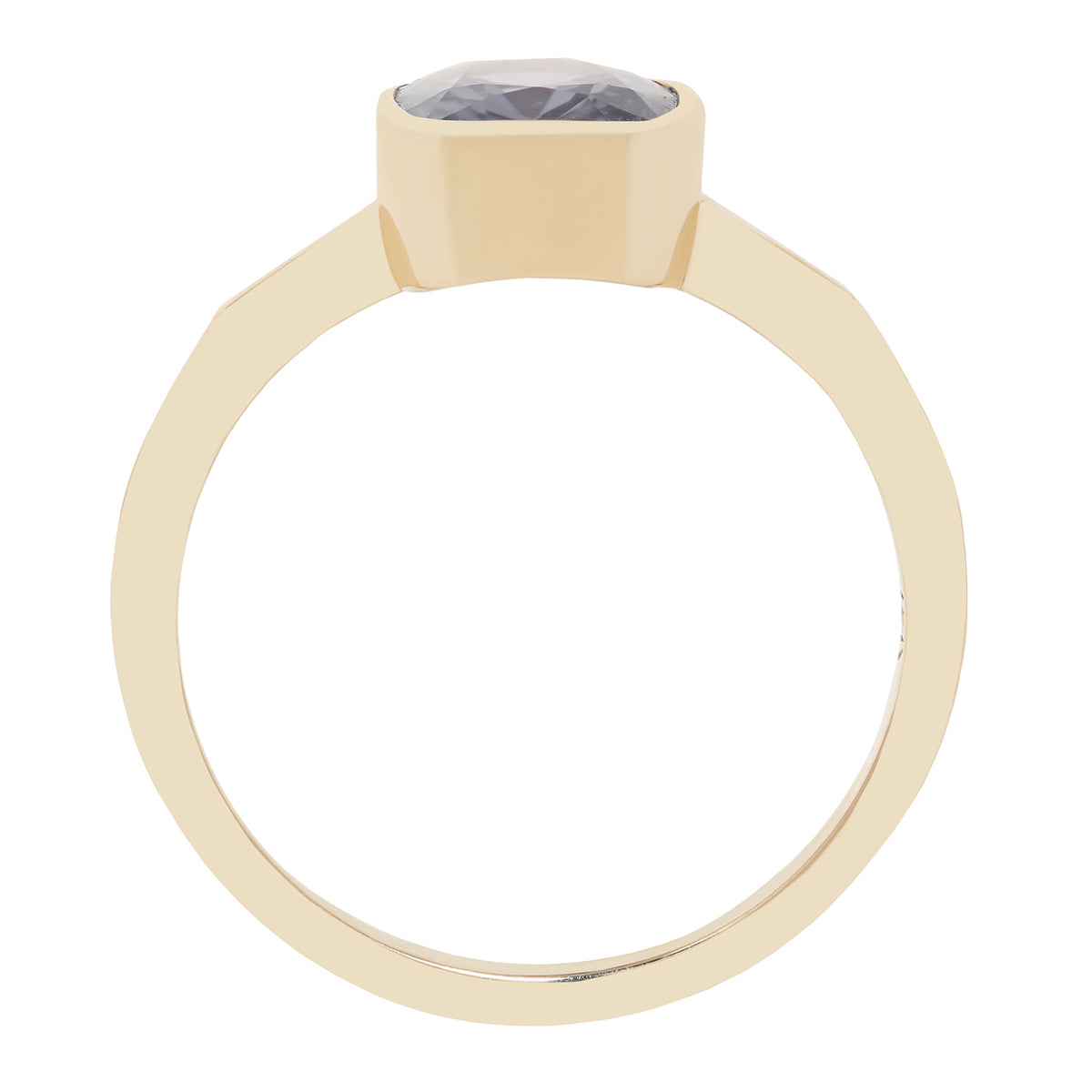 Bezel set solitaire yellow gold ring with a dark blue spinel rectangular stone on white background. 