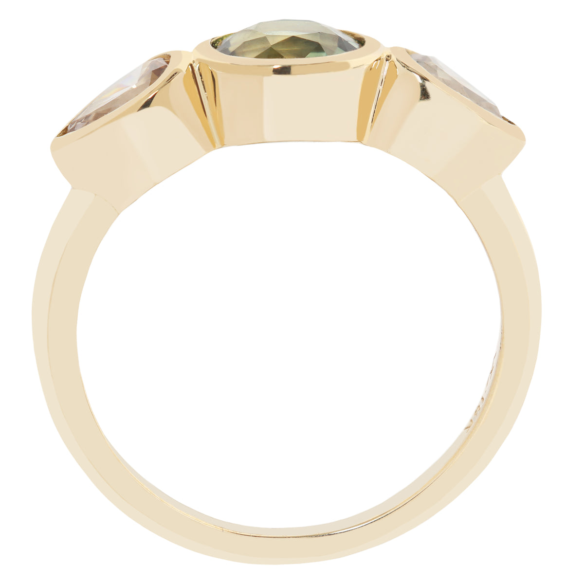 A yellow gold ring featuring a large oval-cut olive green gemstone in the center, flanked by two smaller round-cut clear gemstones in a three-stone setting, shown on a plain white background.