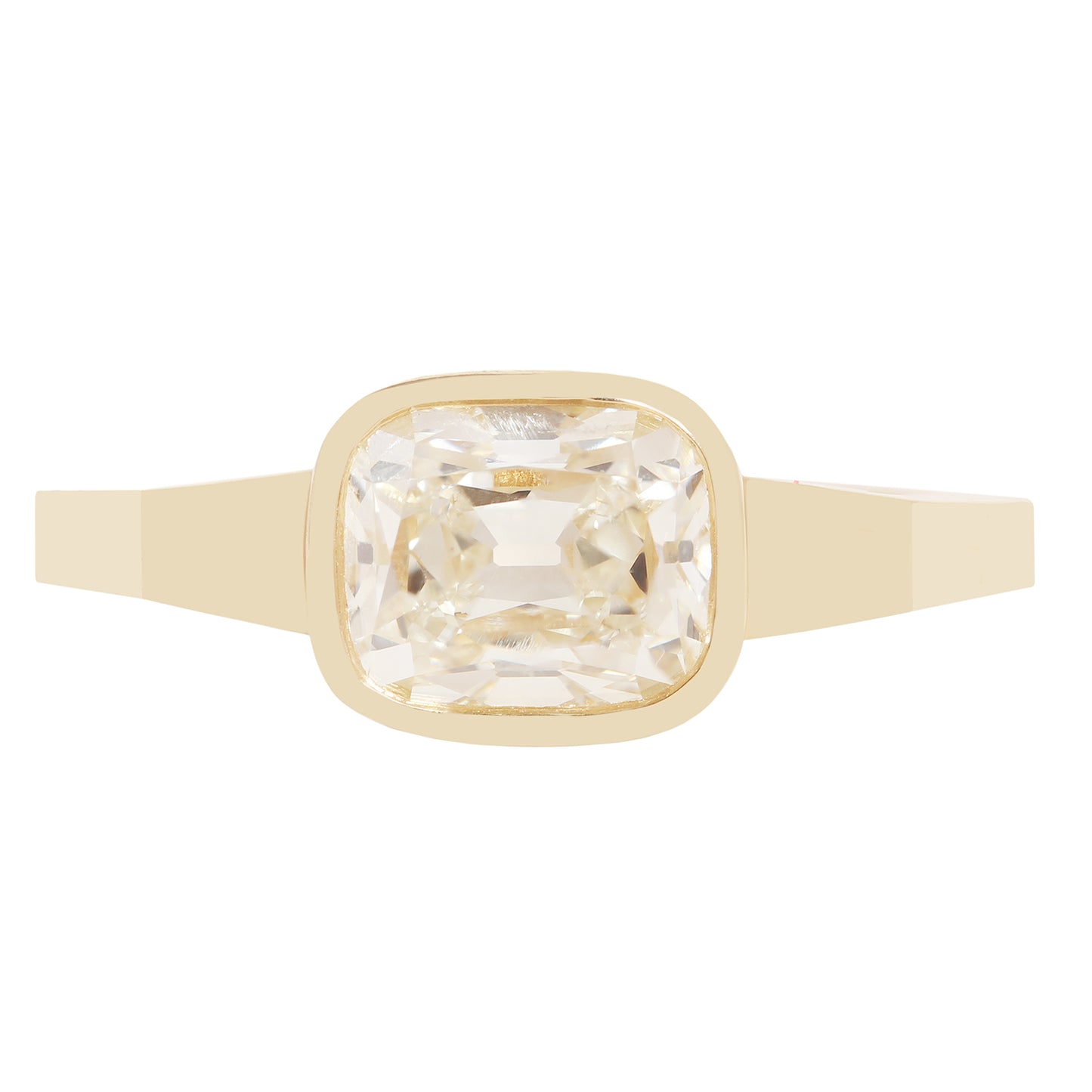 A gold ring with a square bezel-set clear diamond 