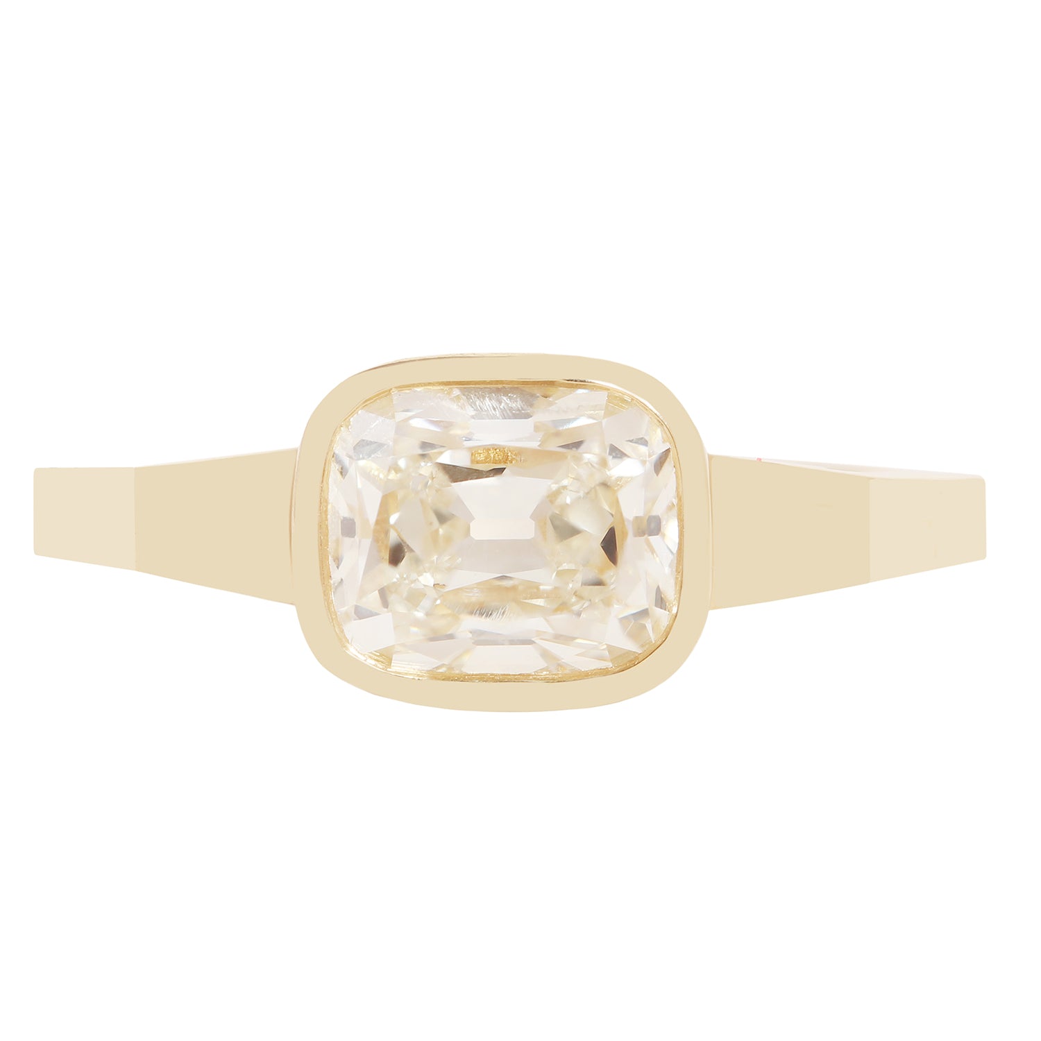 A gold ring with a square bezel-set clear diamond 