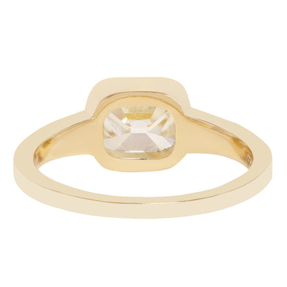 A gold ring with a square bezel-set clear diamond 
