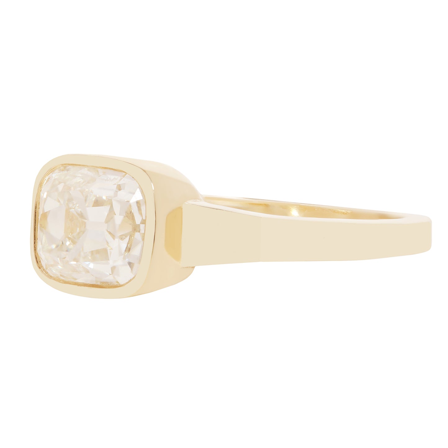 A gold ring with a square bezel-set clear diamond 