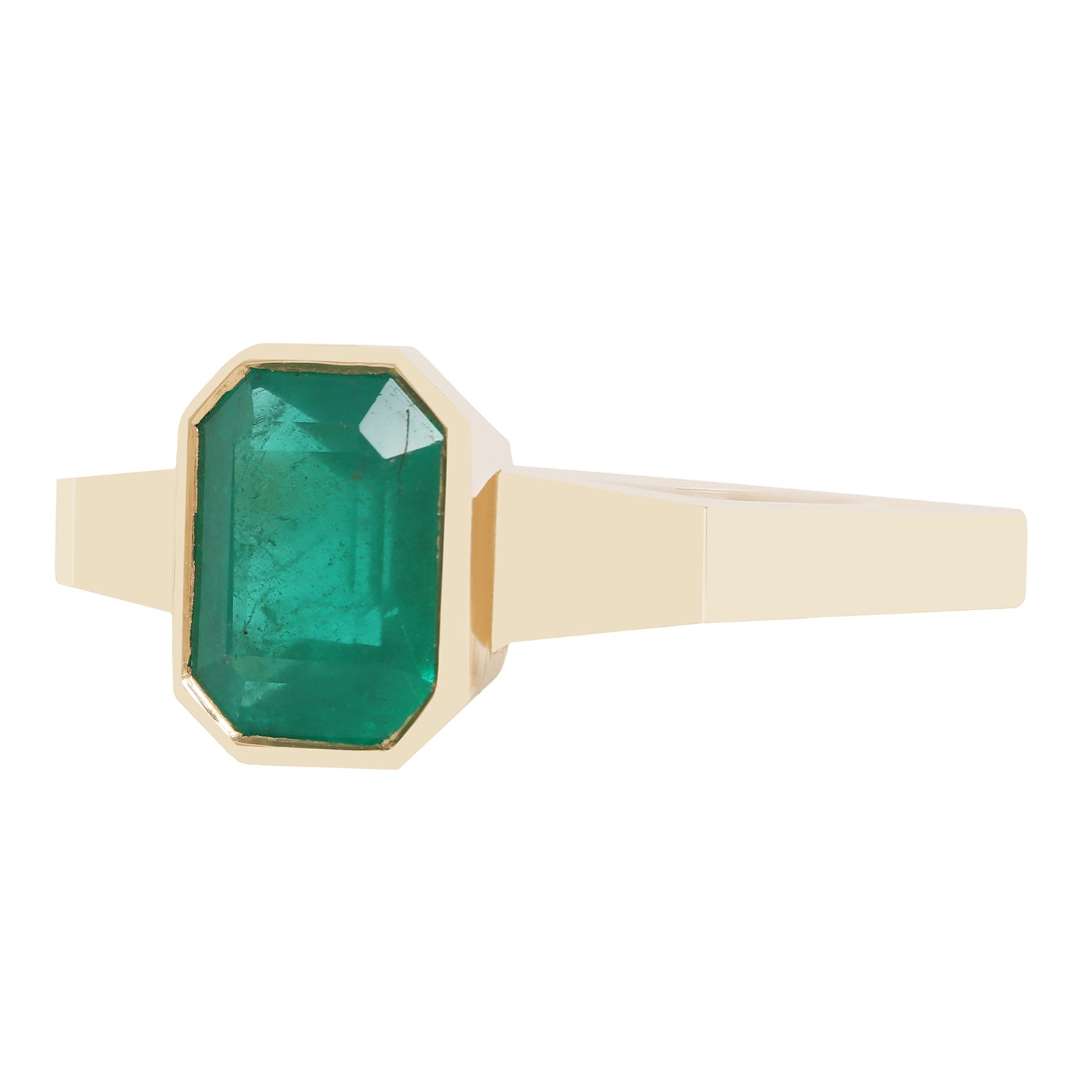 A close-up of a gold ring with a rectangular green gemstone, set against a plain white background.