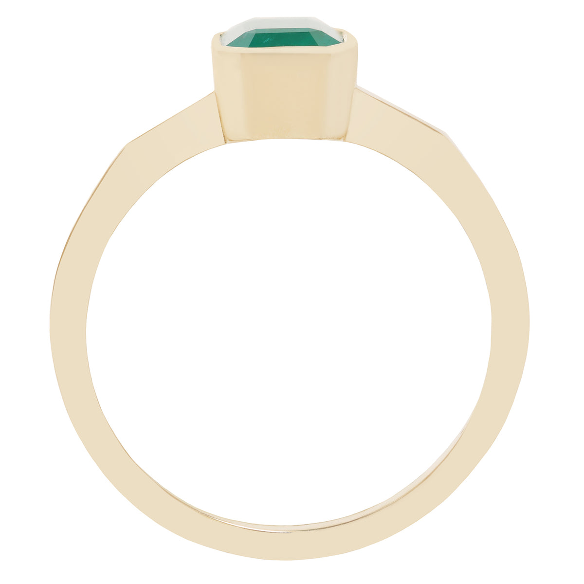 A close-up of a gold ring with a rectangular green gemstone, set against a plain white background.