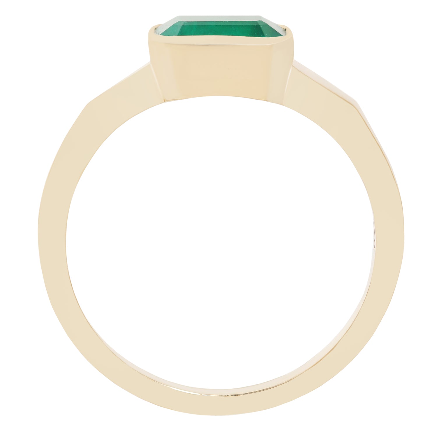 A yellow gold ring featuring a rectangular green gemstone in a bezel setting, shown against a plain white background.