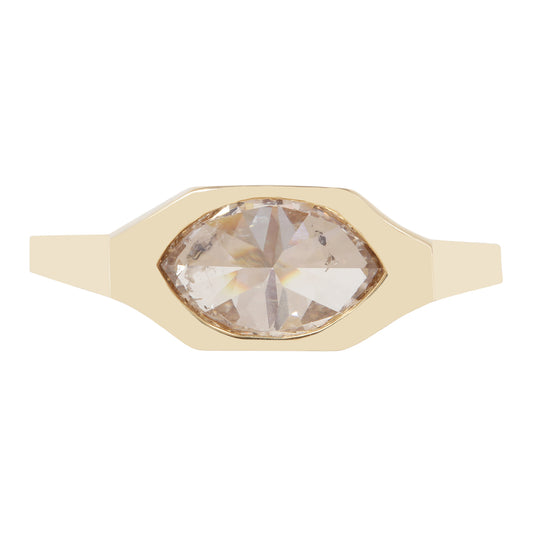 A gold signet-style ring featuring a large marquise-cut pale pink gemstone in a bezel setting, shown against a plain white background.