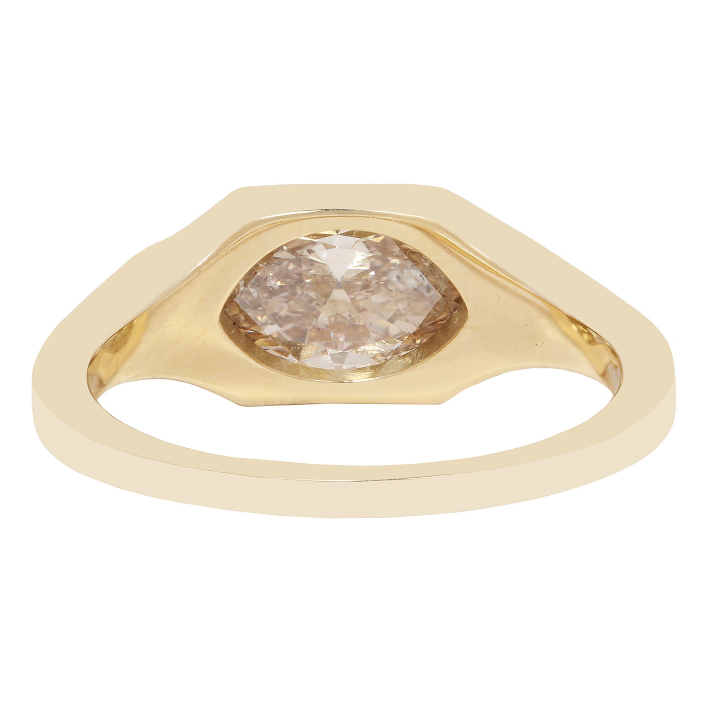 A gold ring featuring a large, irregularly shaped rose-cut diamond center stone, shown on a plain white background.