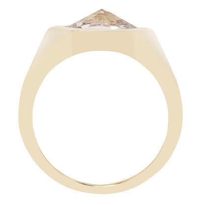 A yellow gold ring with a large, pointed-cut clear gemstone on a plain white background.